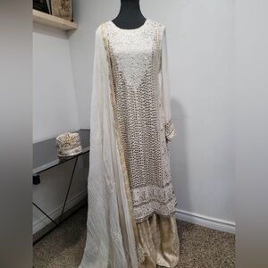 White and golden king kameez with sharara pants.